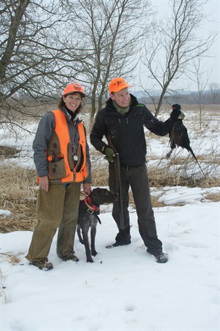 Hunters with pheasant